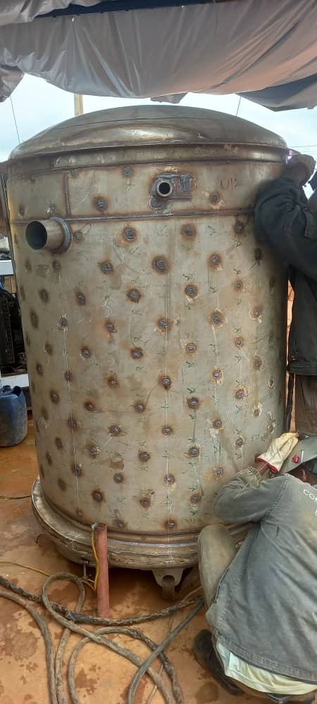 Large cylindrical steel drum with heating grid jacket