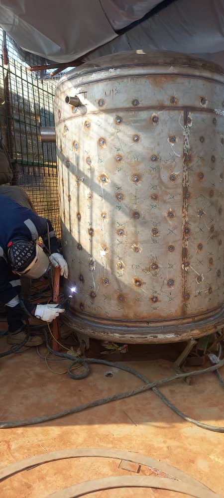Insulated processing tank under final stage assembly