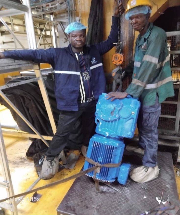 Technicians performing inspection on floor level machinery